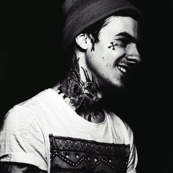 Crossed skeleton keys male face tattoos