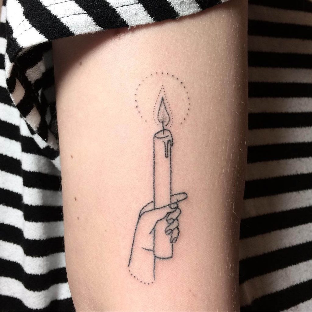 Hand Holding A Candle