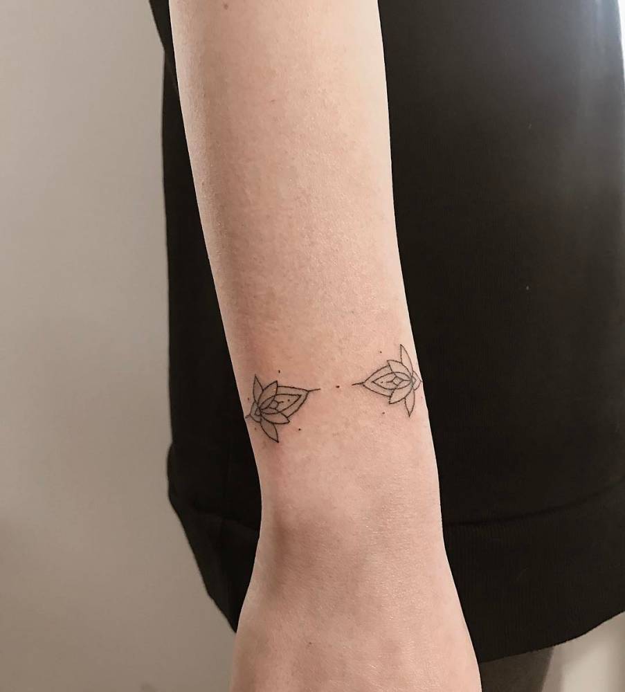 Hand Poked Lotus Flower Bracelet Tattoo