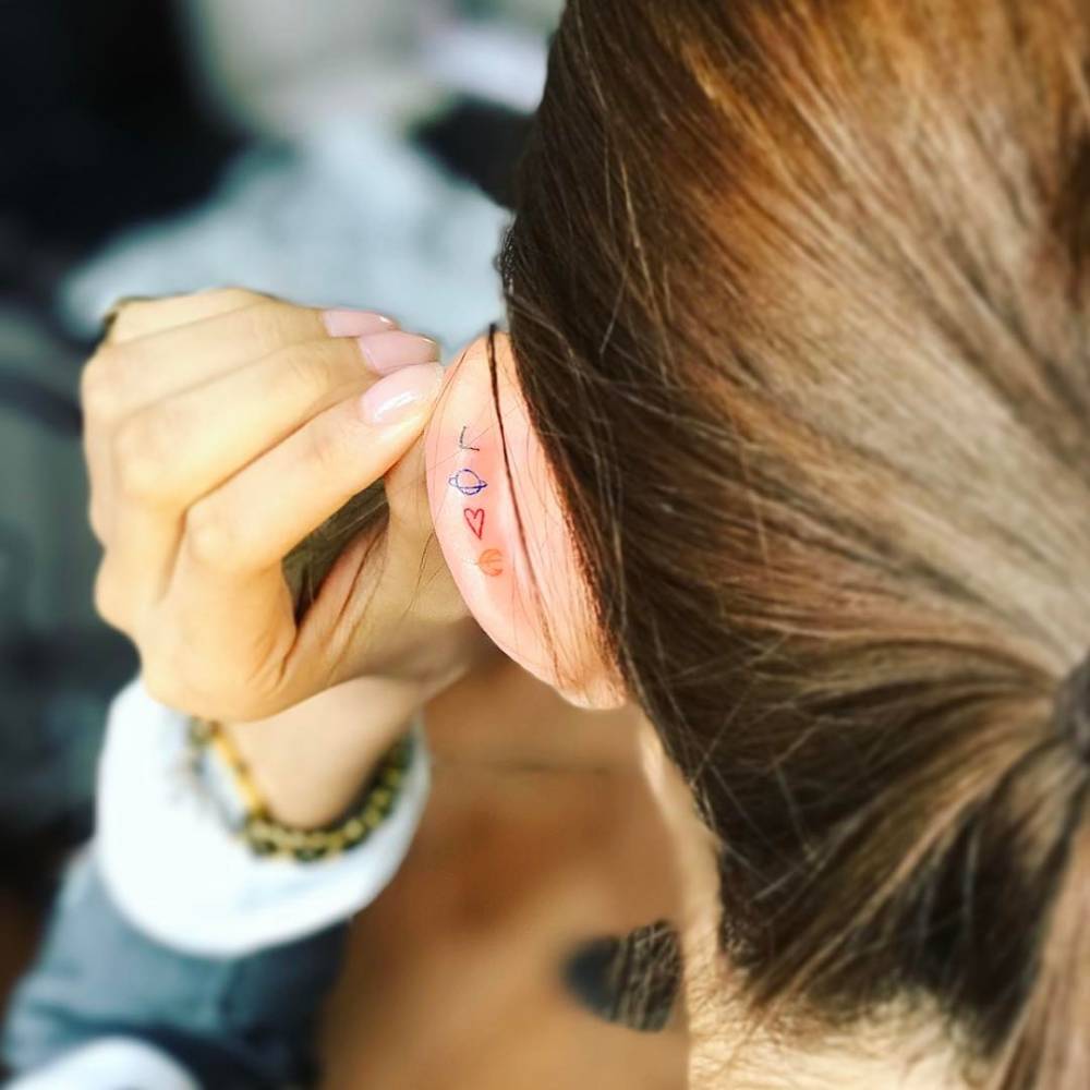 Love Tattoo On The Left Ear