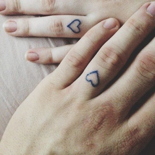 Matching Small Heart Tattoos On Fingers