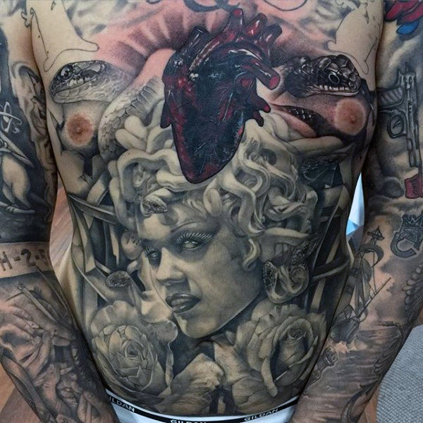 Medusa mens stomach piece tattoos