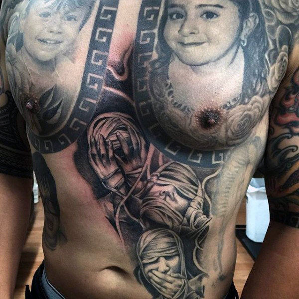 Mummy wrapped mens stomach tattoos on side of body