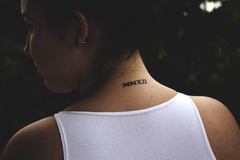 Roman Numerals MMXII Tattoo