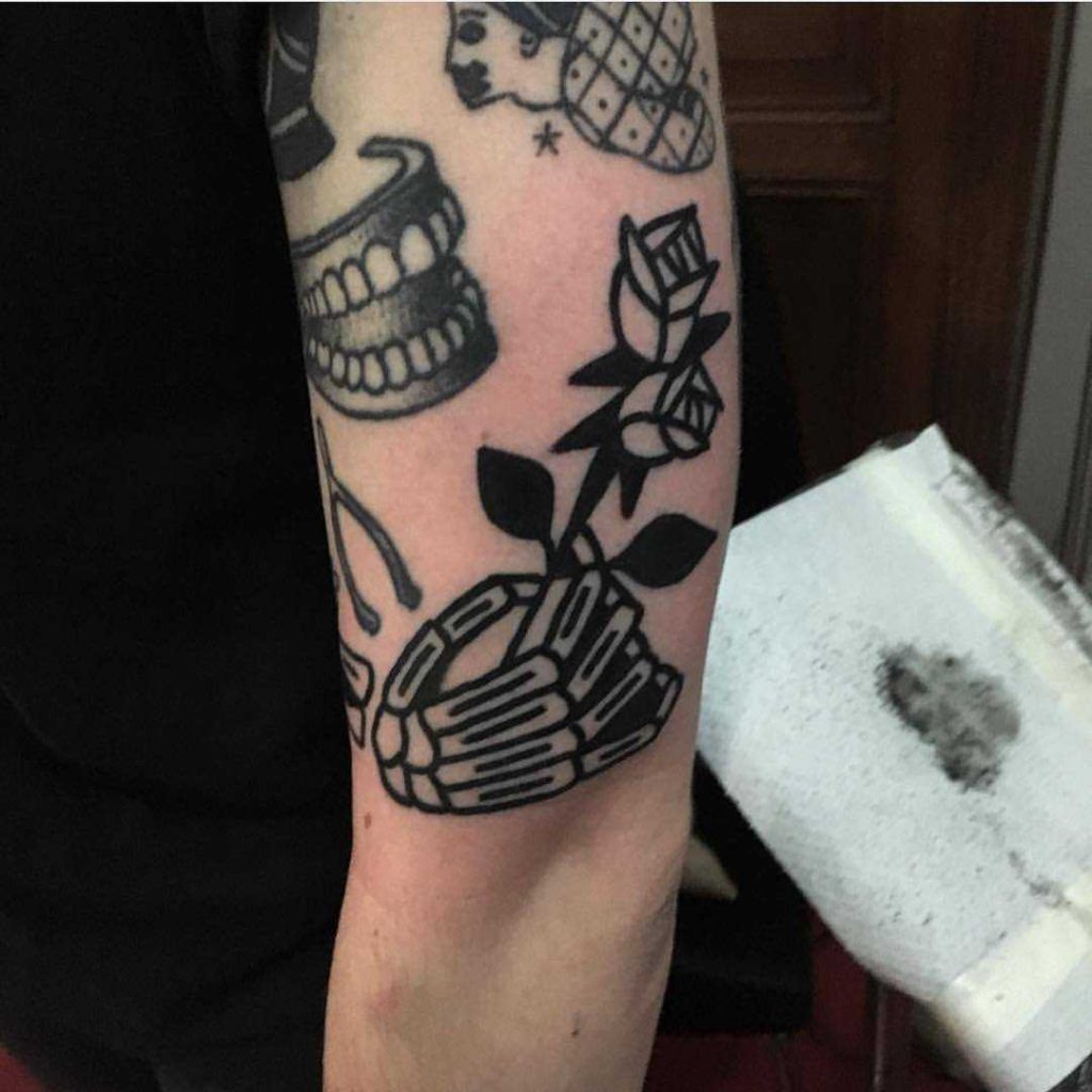 Skeleton Hand And Rose Tattoo
