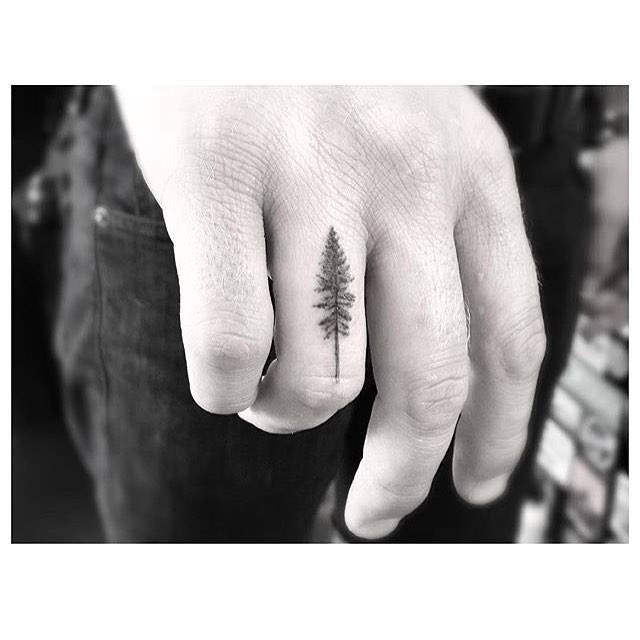 Small Pine Tree Tattoo On The Ring Finger