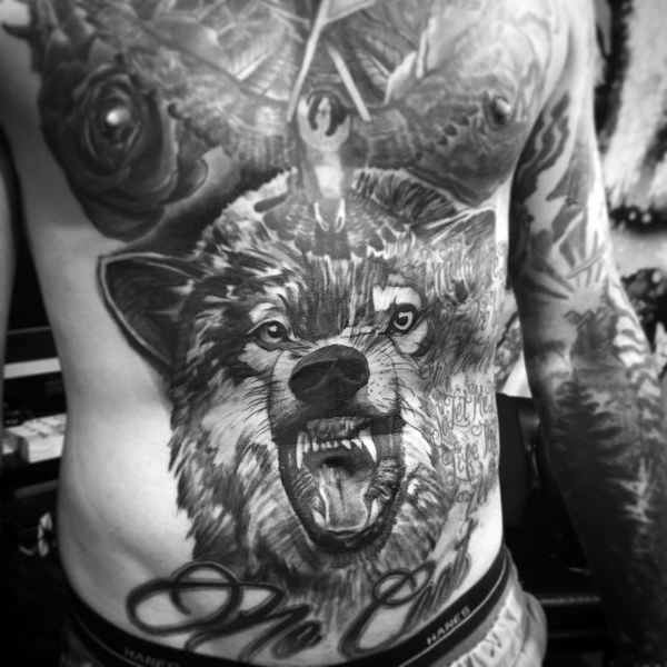 Stomach tattoo for men with giant wolf design