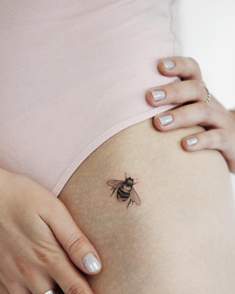 Tiny Bee Tattoo On The Hip
