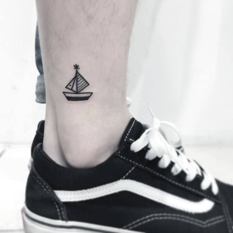 Tiny Boat Tattoo On The Ankle