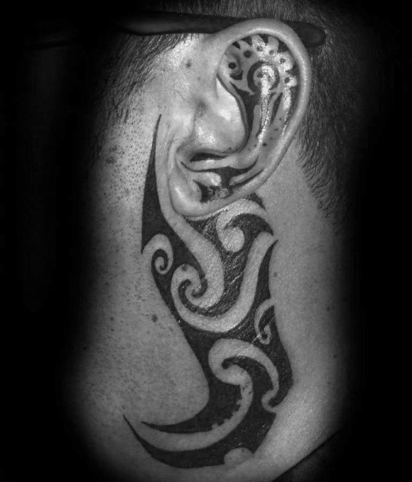 Traditional tribal guys ear tattoo