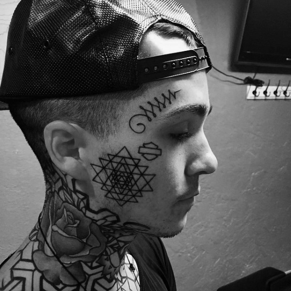 Triangle geometrical male face tattoos