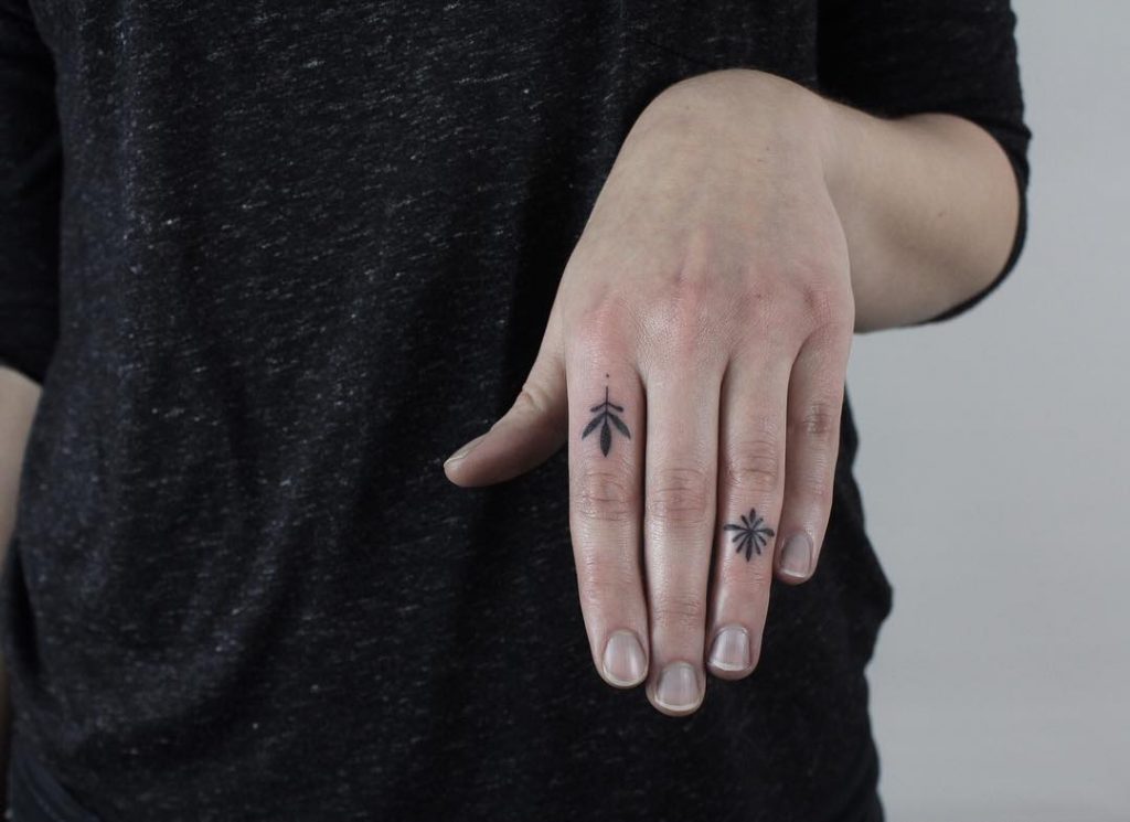Two Tattoos On Fingers