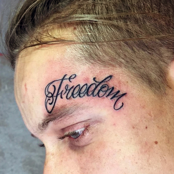lettering freedom word face tattoos above eyebrow