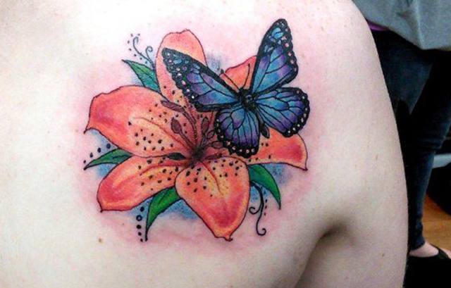 3D tribal style butterfly tattoo on shoulder