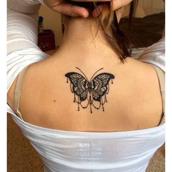 A butterfly tattoo with a chandelier