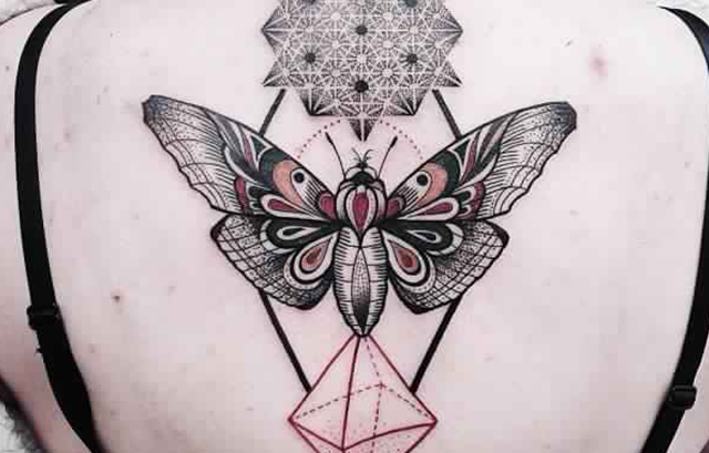 Butterfly tattoo on girls back 