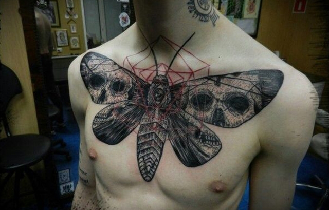 Geometric moth on the chest