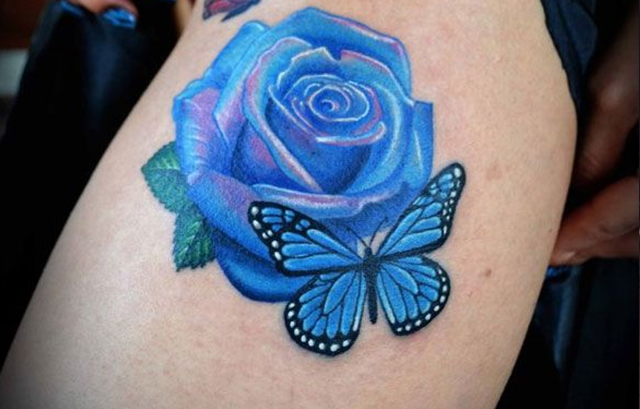 Roses with butterflies tattoo