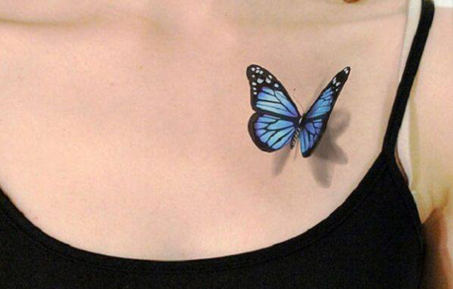 Simple butterfly tattoo on girl's chest