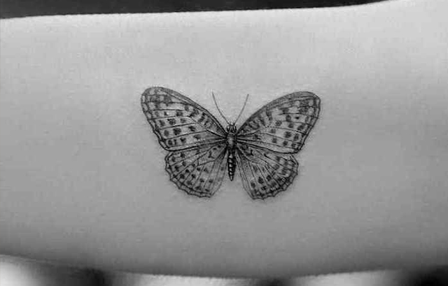 Small black butterfly tattoo