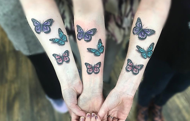 Butterflies tattoo located on the forearm