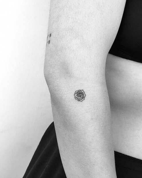 Tiny Black rose tattoo designs on arm