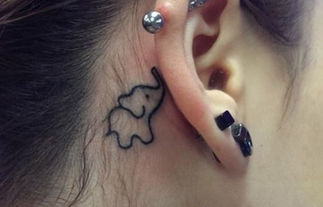 Tiny Elephant tattoo behind ear