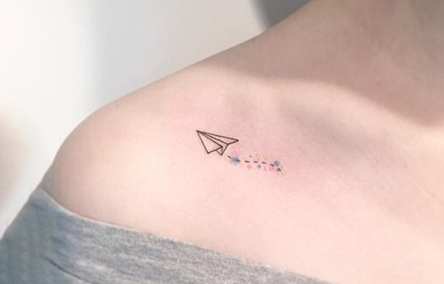 Tiny Flying Plane Tattoo on Shoulder