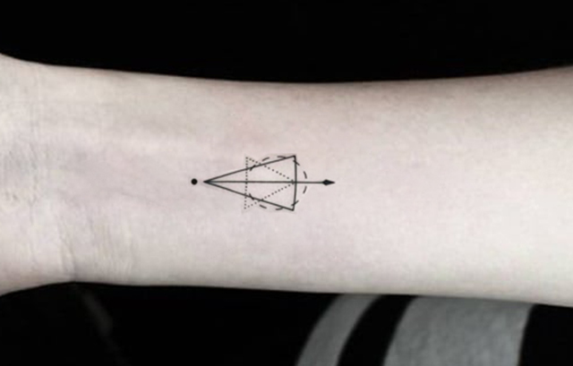 Tiny Geometric Element Tattoo on His Arm