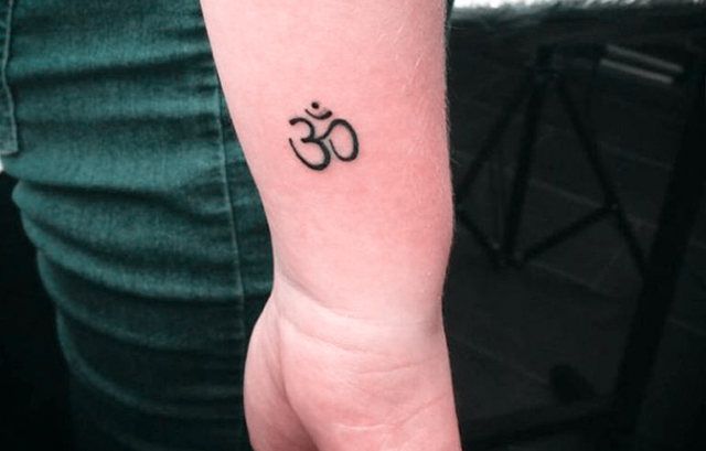 Tiny OM Symbol Tattoo on Your Wrist