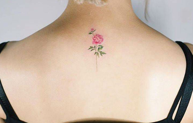 Tiny Rose Flower Tattoo on Her Back