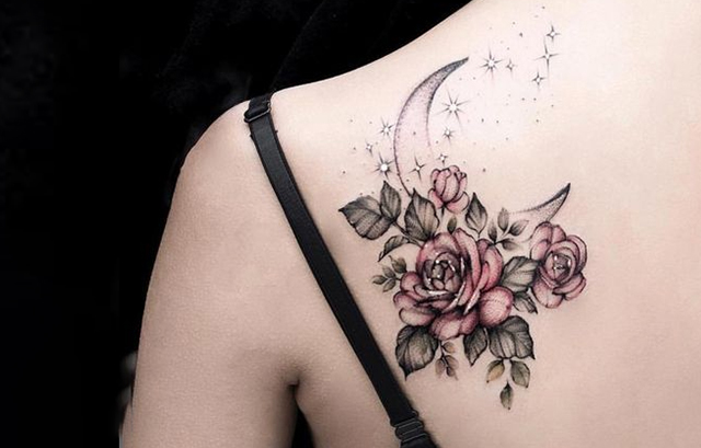 Tiny Star in Flower Tattoo on Her Shoulder