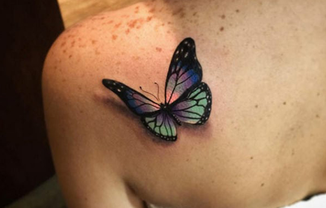 Butterfly Tattoo on back with a touch of realism