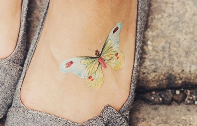 White butterfly tattoo