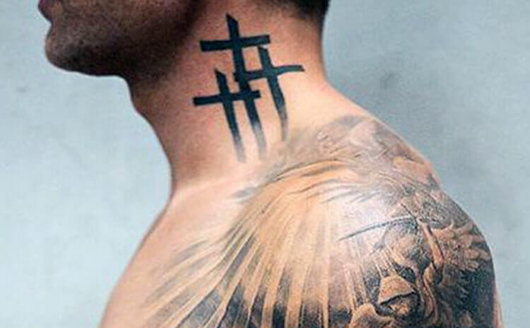 Cross tattoo on nape