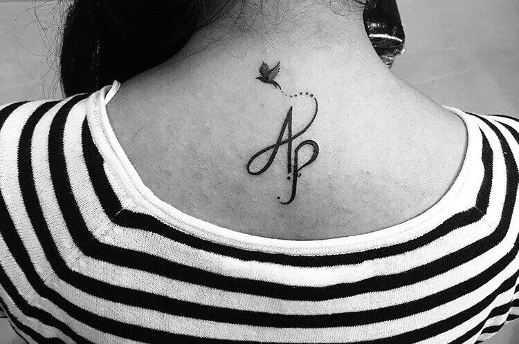 Initials Tattoo on nape