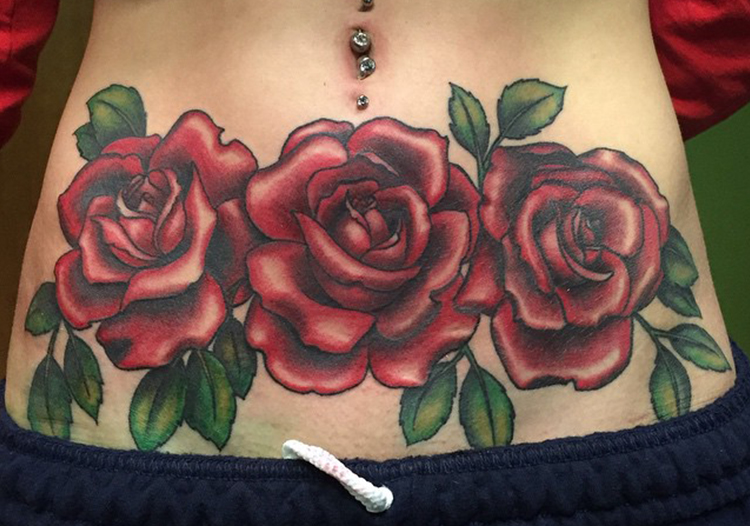 Rose tattoo on tummy