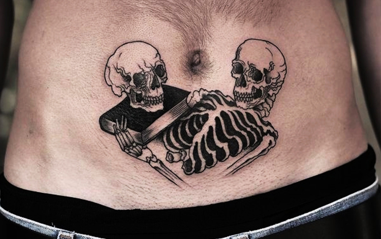 Skull tattoo on tummy