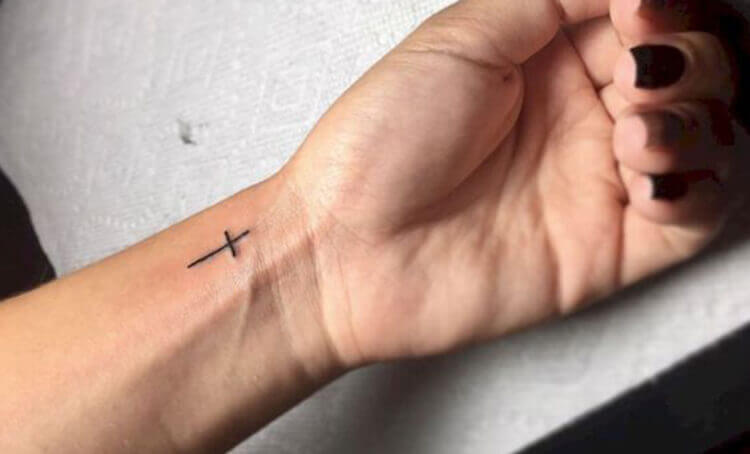 Tiny Cross Symbol Tattoo on wrist