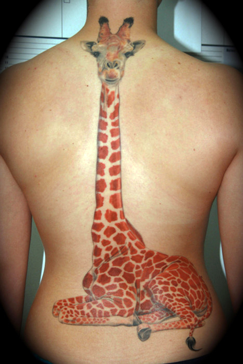 colored giraffe spine tattoo