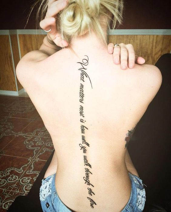 quote tattoo on spine