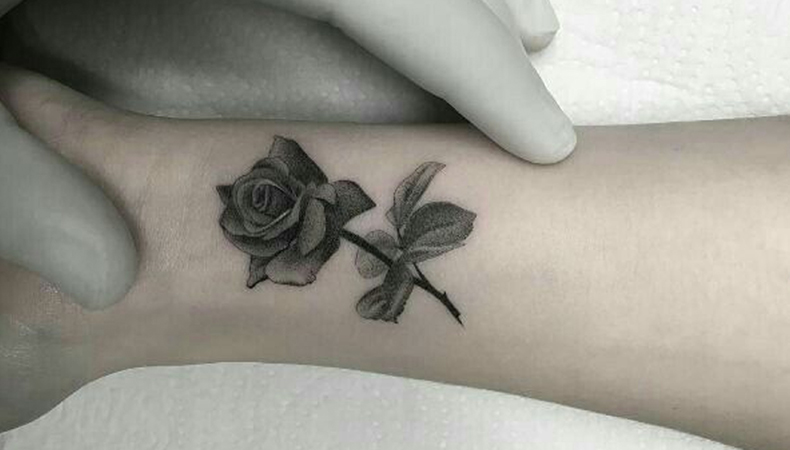 Rose tattoo on wrist