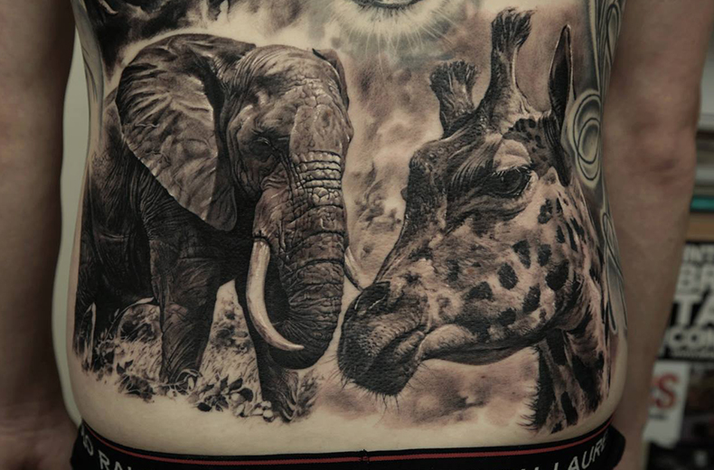 Giraffe Tattoo with elements from nature on your back