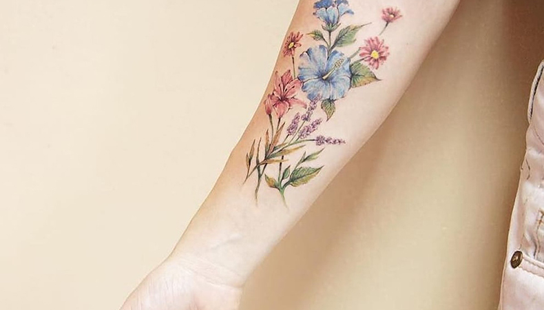 flower inner arm girls tattoo 