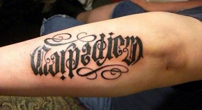 ‘Carpe Diem’ ambigram forearm tattoo