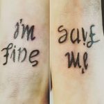 ‘I am fine’ ‘save me’ ambigram thigh tattoo