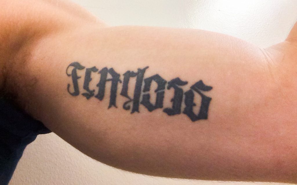 ’Fearless’ on your arm ambigram tattoo