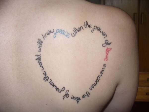 Quote shape heart tattoo on back