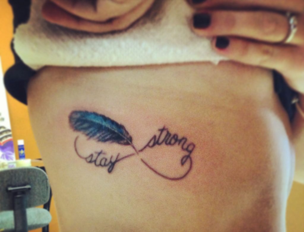 Blue jay feather tattoo