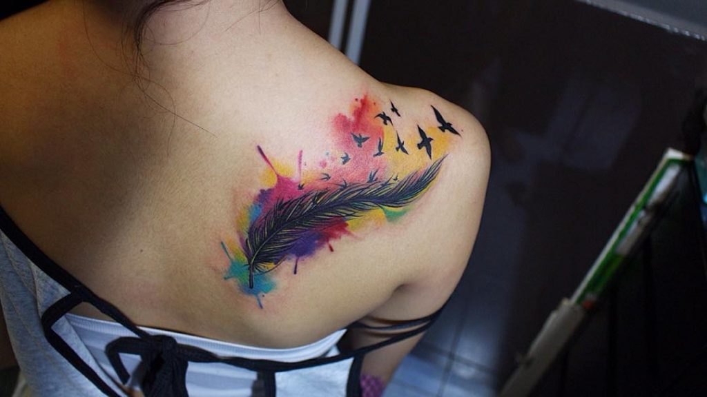 Colorful feather on your shoulder Tattoo
